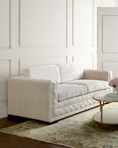 a white couch and table in a room