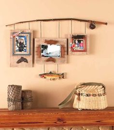 a fireplace with pictures hanging on the mantle