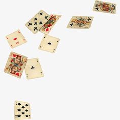 several playing cards falling into the air on a white surface, with one card in the middle