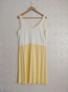 "Super sweet pastel yellow sleep dress/ nightie with floral lace detailing. So adorable! Condition: Excellent. Ready to wear. Very light fabric imperfection due to nature of the natural fabric. Material: Viscose Size: No tag, estimated modern size - M, EUR 40-42, UK 12-14, USA 8-10 Measurements (laying flat and doubled): Bust: 39.3\"/ 100 cm Waist: 33\"/ 84 cm Hips: 40.55\"/ 103 cm Length (shoulder to hem): 40\" / 102 cm Color of product may vary compared to photo due to lighting. Please measure Cream Sleeveless Nightgown For Bedtime, Sleeveless Cream Nightgown For Bedtime, Summer Beige Lace Trim Sleepwear, Yellow Summer Sleep Dress, Beige Lace Trim Sleepwear For Summer, Sleeveless Cream Sleepwear For Loungewear, Sleeveless Cream Loungewear Sleepwear, Sleeveless Cream Sleepwear For Spring, Beige Summer Nightgown For Loungewear