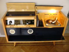 an old record player is turned into a cabinet