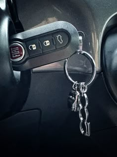 a car door handle with two keys attached to it