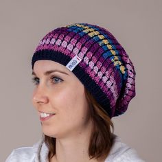 This beautiful hat features a vibrant mix of purple and blue tones, making it a standout piece for your summer wardrobe. Handcrafted from soft crochet yarn, it offers a lightweight, breathable design perfect for keeping you cool on warm days. Designed with a slouchy fit, this beanie provides a relaxed look while ensuring comfort for those experiencing hair loss or sensitivity. Its non-itchy fabric ensures you stay cozy without irritation, making it an ideal choice for everyday wear or as a thoug Purple Bohemian Hats For Winter, Adjustable Purple Casual Beanie, Adjustable Purple Crochet Hat For Winter, Adjustable Casual Purple Beanie, Purple Bohemian Winter Hats, Bohemian Purple Winter Hat, Purple Winter Festival Hat, Purple Festival Winter Hat, Purple Beanie Hat, One Size