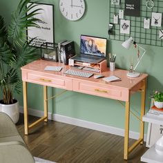 a desk with a computer on it in front of a wall with clocks and plants