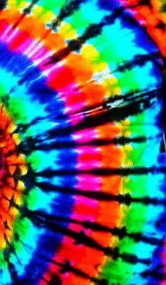 a colorful tie - dyed umbrella is shown in close up