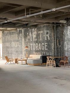 an empty room with chairs and tables in it