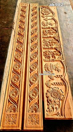 carved wooden doors are lined up on the floor and ready to be put into place