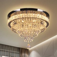 a chandelier hanging from the ceiling in a room