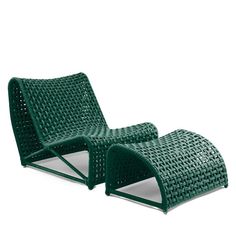 two green wicker lounge chairs sitting next to each other on a white background,