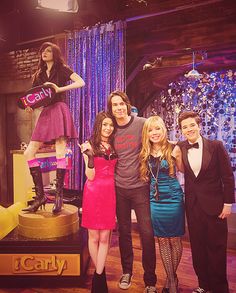 three people posing for a photo in front of a mannequin on the set of nbc's tonight show