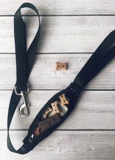 a black lanyard with wooden letters on it