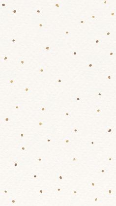 a white background with gold dots on it