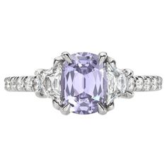 Very attractive 1.41 carat unheated Lavender Sapphire cushion, three stone platinum ring, decorated with a pair of 0.45 carats, E color/VS2-SI1 clarity, French cut trapezoid diamonds, and a total of 0.20 carats round brilliant diamonds. Size 6. Re-sizing is complimentary upon request. The GIA gem report is attached to the image selection for your reference. Returns are accepted and paid by us within 7 days of delivery. Please FOLLOW the MERKABA storefront to be the first to view the latest of our ultra exclusive jewels and supreme gemstones. Merkaba Jewelry, is a unique, world-class jewelry brand, dedicated to unveiling the rarest, finest and most sought-after gemstones globally, such as Alexandrite, Paraiba Tourmaline, "no oil" Emeralds, unheated Sapphires and Rubies, Padparadscha Sapphir Lavender Sapphire, Purple Sapphire Ring, Chrome Tourmaline, Demantoid Garnet, Imperial Topaz, Padparadscha Sapphire, French Cut, Purple Sapphire, Star Sapphire