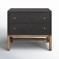 a black and wood dresser with two drawers on one side, against a white background