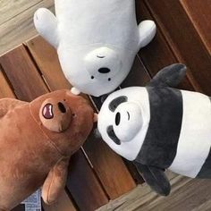 two stuffed animals sitting next to each other