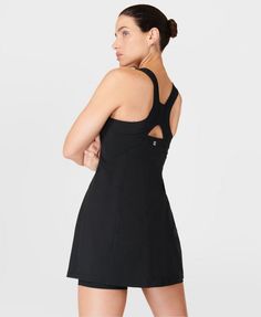 Our sporty new workout dress for styling out the sweatiest of sessions. Sweat-wicking Power Pro fabric is breathable and stretchy with a matte finish. Slim, body-skimming fit with contrasting panels and a flattering racerback. Supportive inner shorts with slip pocket. In-built bra with removable pads. Length: 77.5cm / 31". Model wears size S and is 178cm/5'10" tall. Style Code: SB9287BColour: Black Sporty Tennis Activewear With Built-in Bra, Sporty Tennis Dress With Built-in Bra For Gym, Sporty Mini Dress With Built-in Bra For Workout, Black Tennis Dress With Built-in Bra, Sporty Activewear For Workout With Streamlined Fit, Sporty Activewear With Streamlined Fit For Workout, Sporty Activewear For Workout, Sleek Activewear With Built-in Bra For Sports, Workout Dresses With Built-in Bra And Racerback