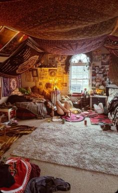 a room filled with lots of clothes and rugs