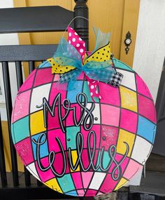 a colorful door hanger with the word'mrs chillple'painted on it