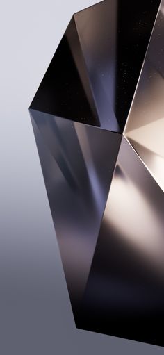 a shiny metal object is shown against a gray background