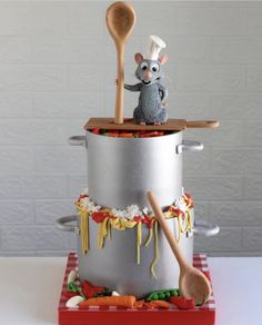 a cake made to look like a mouse cooking