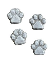 three silver paw prints on a white background