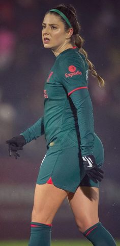 a female soccer player in action on the field