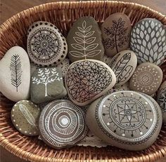 a basket filled with lots of rocks sitting on top of a wooden floor