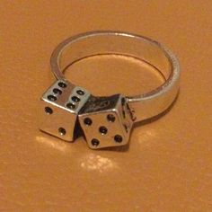 This Is A Brand New Boutique Item! Very Cool Lucky Dice Ring. Solid Stainless Steel. Beautifully Made. Approximately 0.25” Profile. Size 7. All Of My Boutique Jewelry Is Nickel Free And High Quality! Please Check Out My Closet For An Extensive Collection Of High End Designer And Boutique Jewelry Pieces! Tags Free People Anthropologie Zara Madewell J. Crew Urban Outfitters Modcloth Betsey Johnson Joy Dravecky Verameat Boho Gypsy Witchy Tarot Celestial Crystal Pin Up Dolls Kill Superstition Lucky Dice Ring, Dice Jewelry, Number Seven, Hype Beast, Celestial Crystal, Unusual Jewelry, Lucky Number, Cool Pins, Funky Jewelry