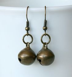 These bell earrings are made of the jingle bell charms. This bell does ring. The bell charm and earwires are made of antique brass plated base metal. These earwires are hypo-allergenic and nickel-free. There are two different sizes of bell for you to choose, 11.5mm and 13.5mm. The size of 11.5mm bell earrings is 37mm long. The size of 13.5mm bell earrings is 40.5mm long. Bell Earrings, Ring The Bell, Women Anklets, Forest Hills, Jingle Bell, Green Ribbon, Name Bracelet, Jingle Bells, Adjustable Bracelet