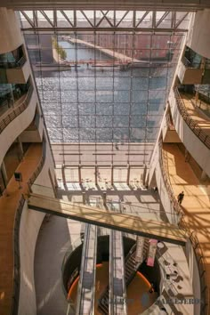 an escalator in the middle of a large building