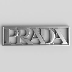 the word prada is made up of letters and shapes in silver on a gray background