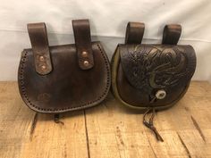 "Medieval Viking Belt Pouch, Hand stitched, Hand tooled gold Jörmungandr serpent on the top flap. Brown body is made of 7.5-10 oz dyed veg tan, and the Honey brown gusset is made of 7.5 oz oil tan. Copper riveted belt straps for no rust long lasting strength. Pouch measure approx. 7.5\"wide, 6\" tall(plus straps) Antler button closure, with latigo lacing and metal beads" Fantasy Ranger, Anna Outfit, Leatherworking Ideas, Belt Pouches, Handmade Leather Work, Leather Utility Belt, Leather Medicine Bag