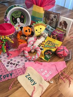 a table topped with lots of toys and books on top of a hard wood floor