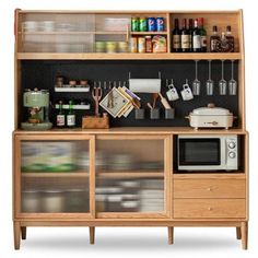 a kitchen cabinet with many items on it