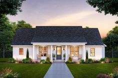 a small white house with lots of windows on the front and side of it, surrounded by greenery