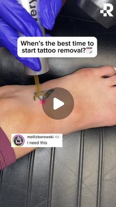 someone is getting their tattoo done on the foot with purple gloves and blue rubber gloves