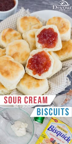 some biscuits with jam on top and butter in the middle