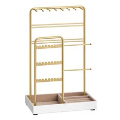 a gold and white rack with three shelves