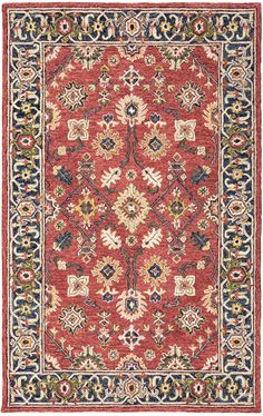 a red and blue rug with an ornate design