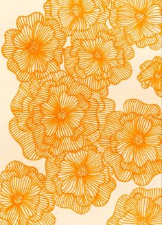 an orange flower pattern on a white background