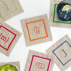 several coasters with different colored letters and numbers on them, including the letter b