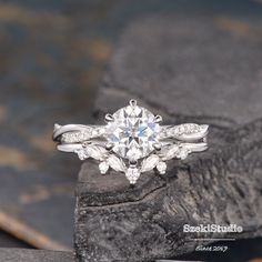 a white gold engagement ring with diamonds on top