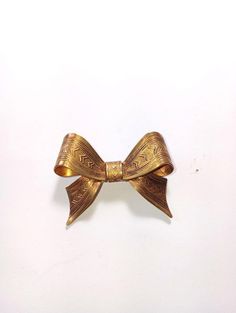 Vintage Brass bow with no history..       The bow is in perfect condition. measures 1 1 3/4 inches Gold Satin Bow For Gift, Gold Ribbon Bow For Gifts, Brass Bow, Bow Pendant, Vintage Brass, Pendant Necklaces, Favorite Jewelry, Jewelry Necklace Pendant, Beauty Book