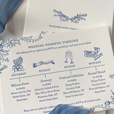 two blue and white wedding programs on top of each other