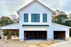 a large white house with two car garages