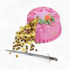 a pink cake with flowers and stars on it next to a pair of scissor