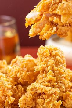 the fried food is being held up by a fork