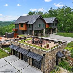 this is an aerial view of a house in the mountains