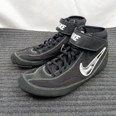 a pair of black and silver nike sneakers