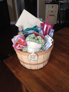 a basket filled with lots of items on top of a wooden table